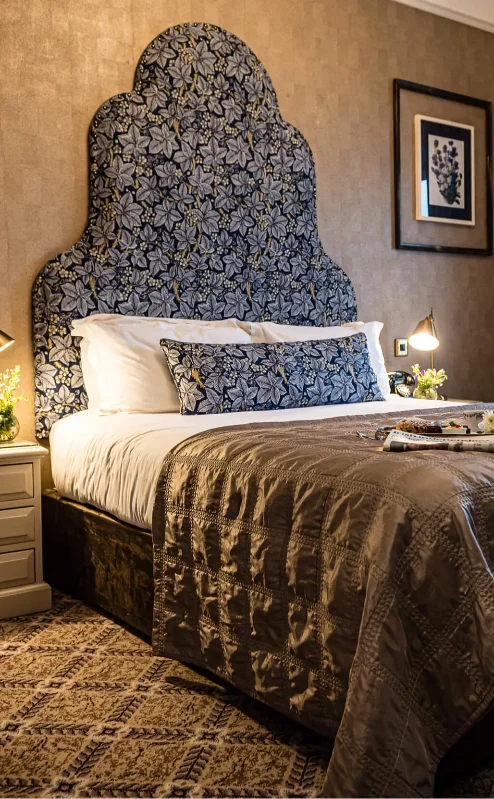 Cosy hotel room with elegant decor and large window, arranged for guest comfort