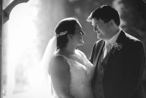 Smiling couple on their wedding day at Fernhill House Hotel.