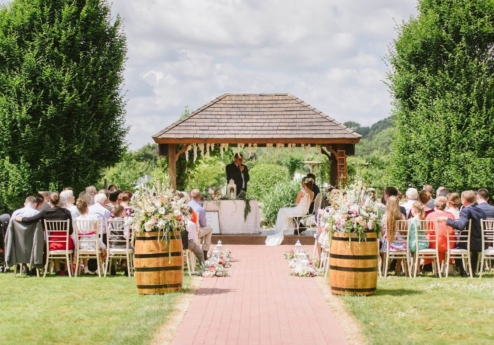 Outdoor wedding ceremony at Fernhill House Hotel with guests seated on a sunny day.
