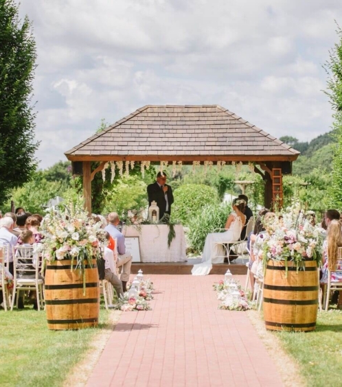 Outdoor wedding ceremony at Fernhill House Hotel with guests seated on a sunny day.