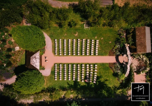 Aerial view of Fernhill House Hotel garden with arranged seating for an outdoor event.