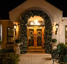 Fernhill House Hotel entrance adorned with festive lights, creating a warm welcome.