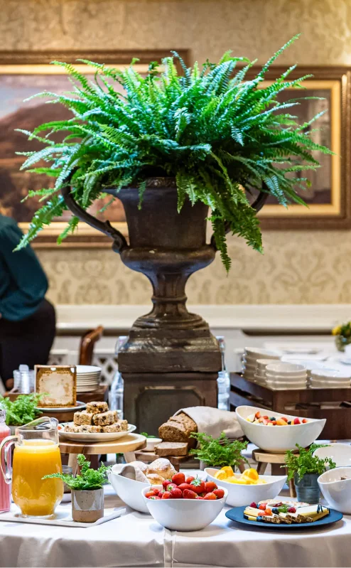 Elegant breakfast buffet in a cosy dining room with family enjoying their meal.