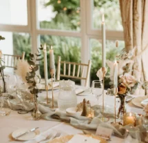 Elegant dining table set for a family gathering in a sunlit room with garden views.