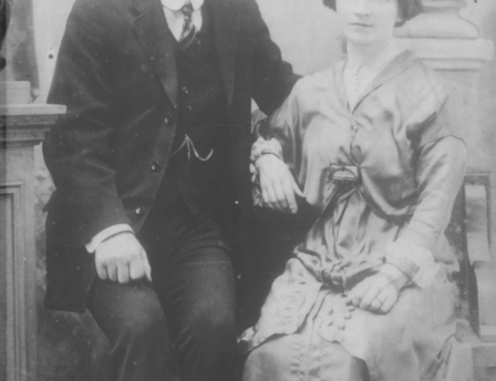 Vintage photo of a couple in formal attire, sitting together at Fernhill House Hotel.