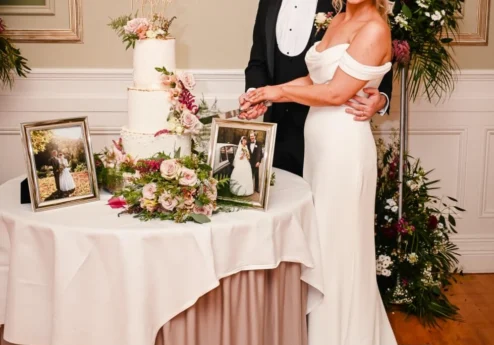 Couple cutting wedding cake at Fernhill House Hotel reception.