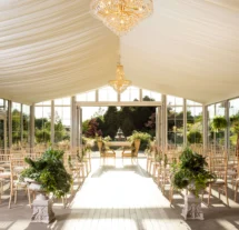 Elegant wedding venue with chandeliers and garden view at Fernhill House Hotel.