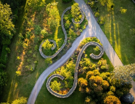 Aerial view of lush gardens at Fernhill House Hotel with winding pathways and inviting greenery.