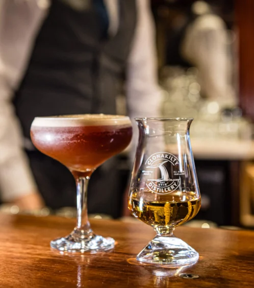 Hotel bar with cocktails, whisky, and a bartender ready to serve.