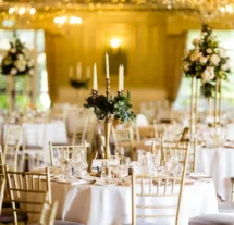 Elegant dining room with candlelit tables set for a family gathering at Fernhill House Hotel.