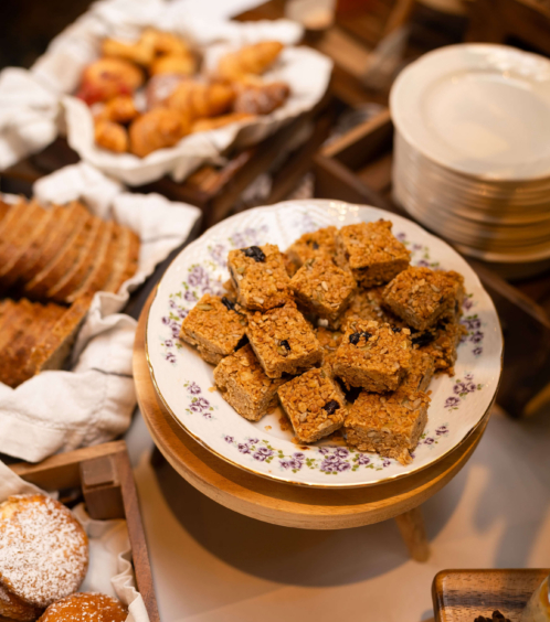 A welcoming breakfast spread with pastries and granola bars at Fernhill House Hotel.