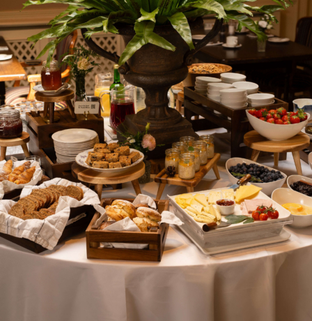 Elegant breakfast buffet with pastries, cheeses, fruits, and yoghurt at Fernhill House Hotel.