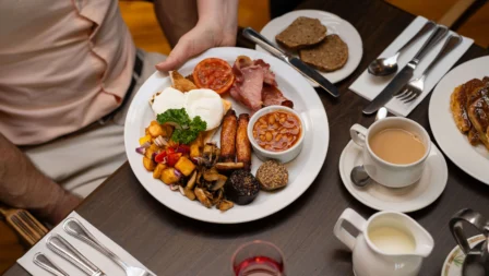 A family enjoys a hearty breakfast at Fernhill House Hotel's cosy dining area.