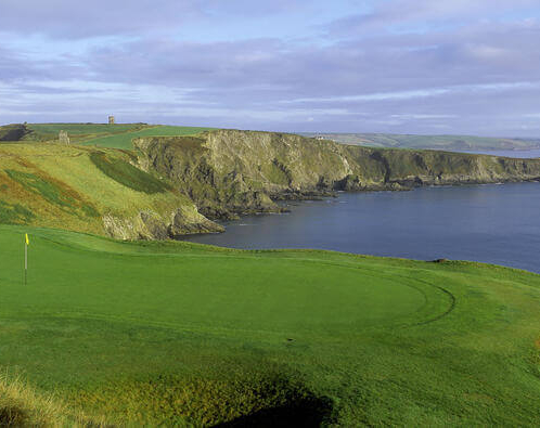 Family enjoying golf on a coastal course at Fernhill House Hotel.