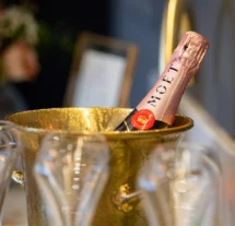 A bottle of Moët champagne in a gold ice bucket at Fernhill House Hotel.
