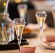 Elegant table setting with champagne flutes at Fernhill House Hotel.