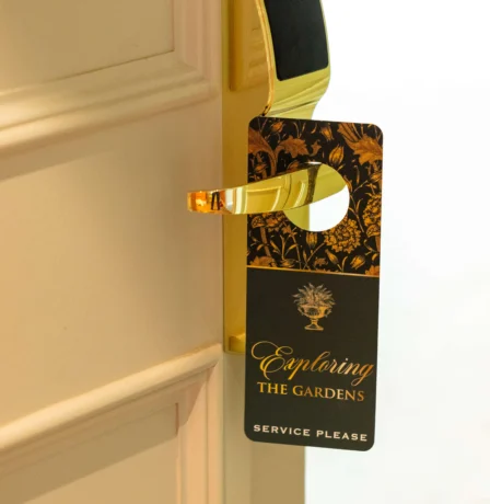 Door with "Exploring the Gardens" sign at Fernhill House Hotel.