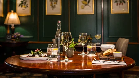 Cosy dining room with elegant table setting and wall art, perfect for a family meal.