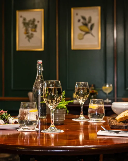 Cosy dining room with elegant table setting and wall art, perfect for a family meal.