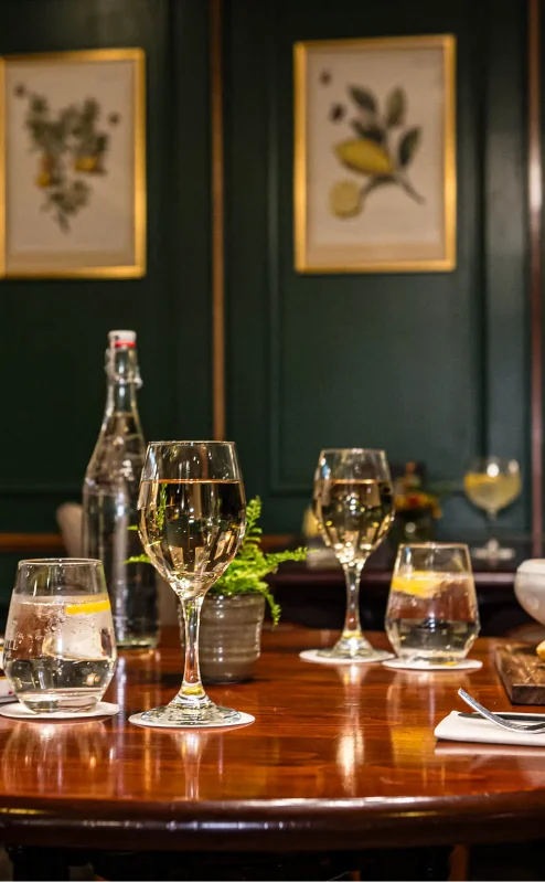 Cosy dining room with elegant table setting and wall art, perfect for a family meal.