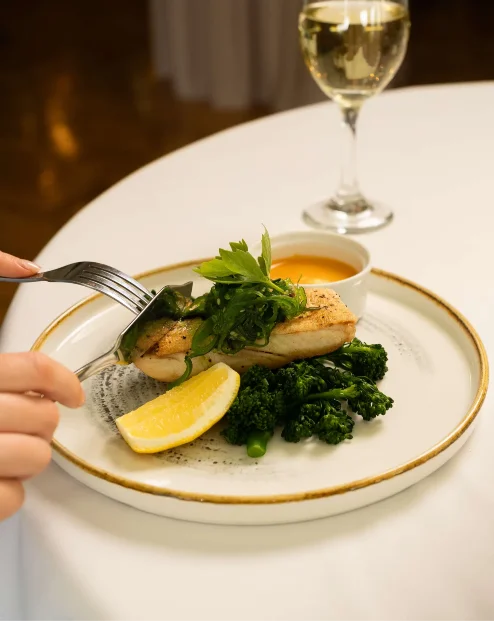 Elegant dining experience with delicious gourmet dish at Fernhill House Hotel.