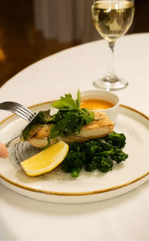 Elegant dining experience with delicious gourmet dish at Fernhill House Hotel.