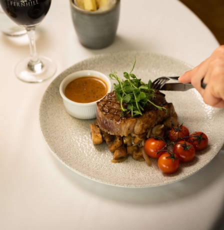 Delicious steak dinner with wine at Fernhill House Hotel
